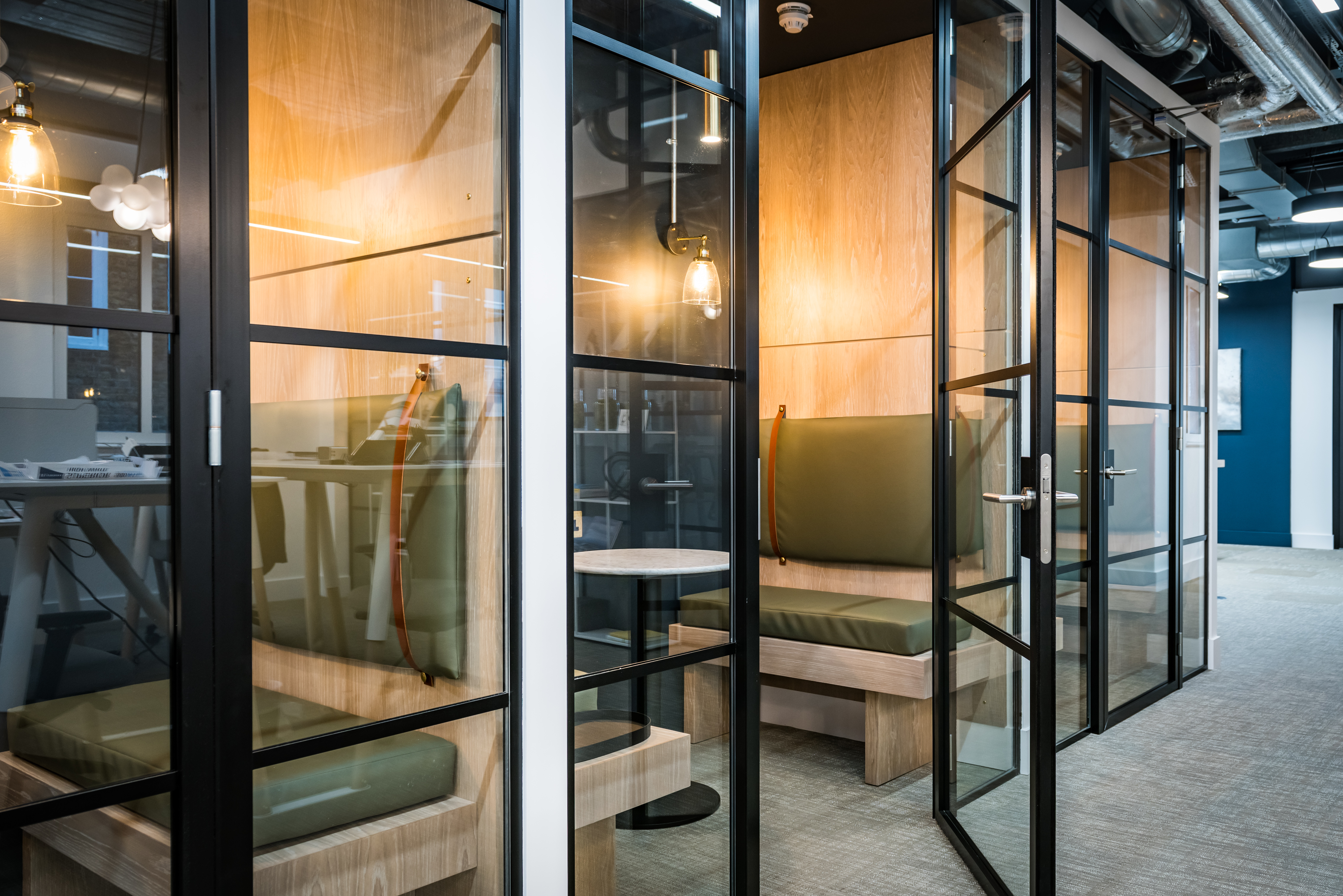 private meeting booths with glass doors at Dawn Capital